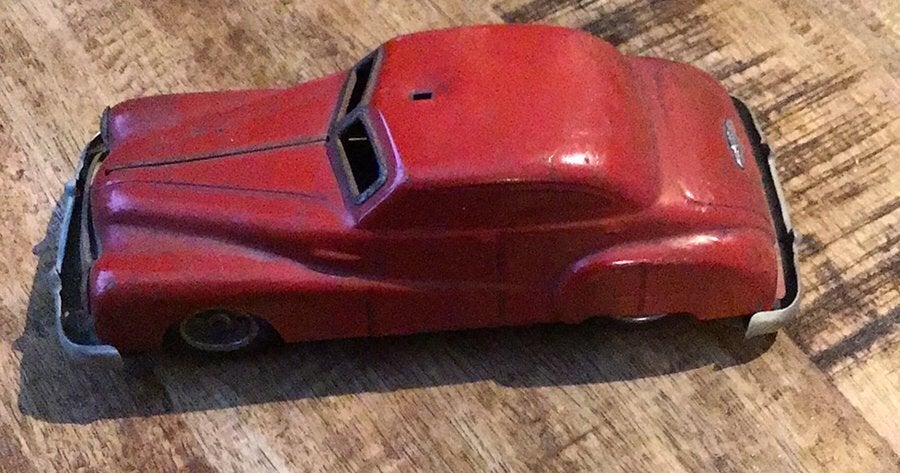 Een oude blikken auto., Antiek en Kunst, Antiek | Speelgoed, Ophalen