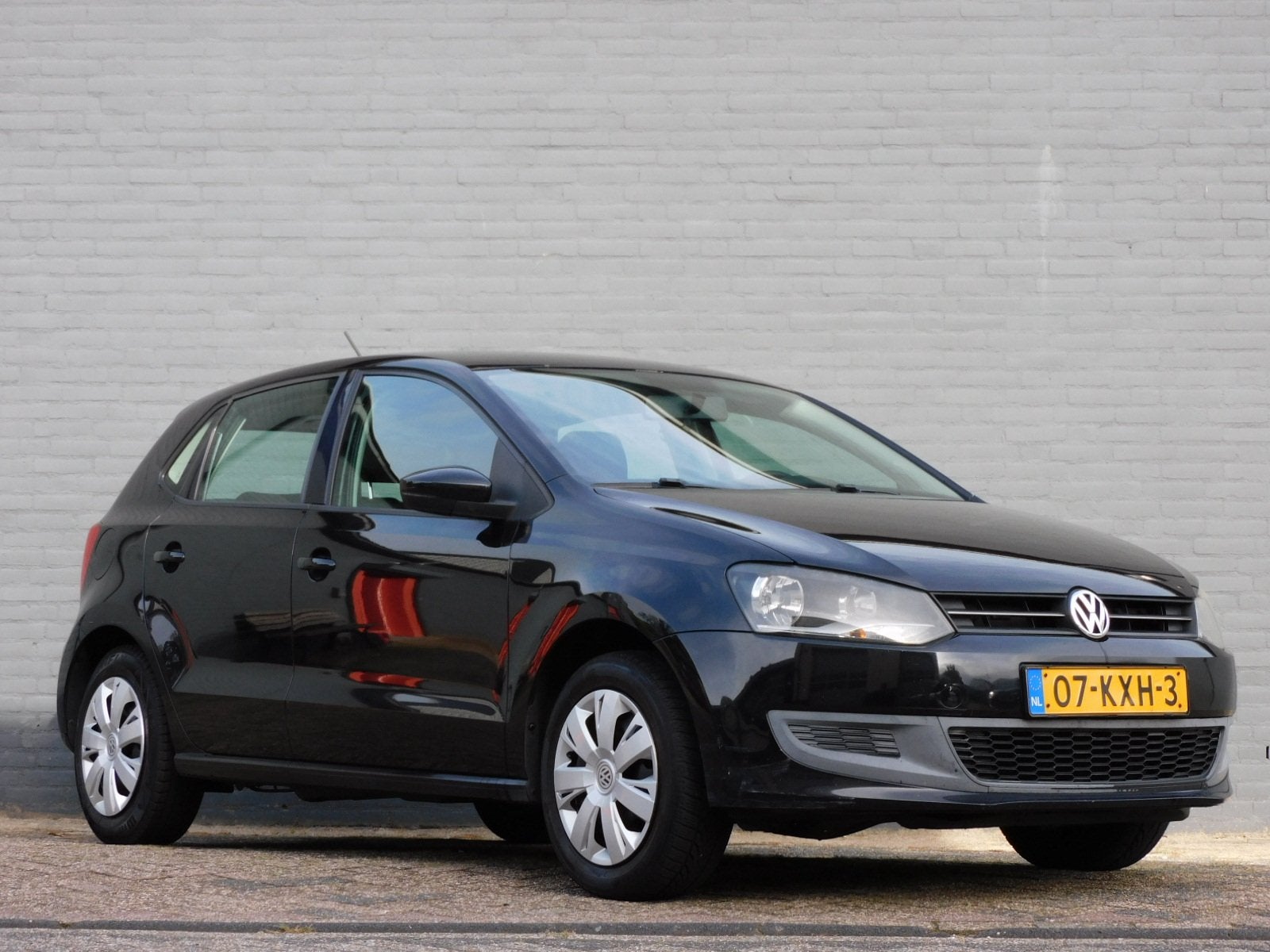 Volkswagen Polo 1.2-12V Comfortline NAVI! BLUETOOTH! CRUISE!, Auto's, Voorwielaandrijving, Euro 5, Zwart, Verwarmde buitenspiegels