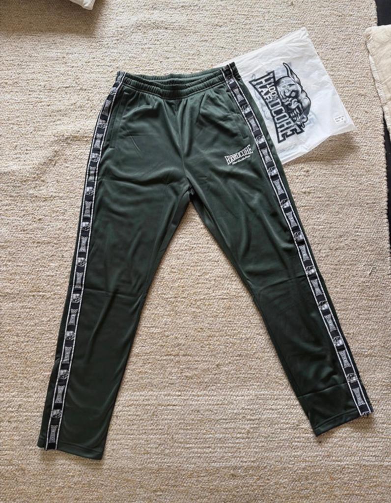 100% hardcore trainingsbroek, Maat 48/50 (M), Nieuw, Ophalen of Verzenden, Groen