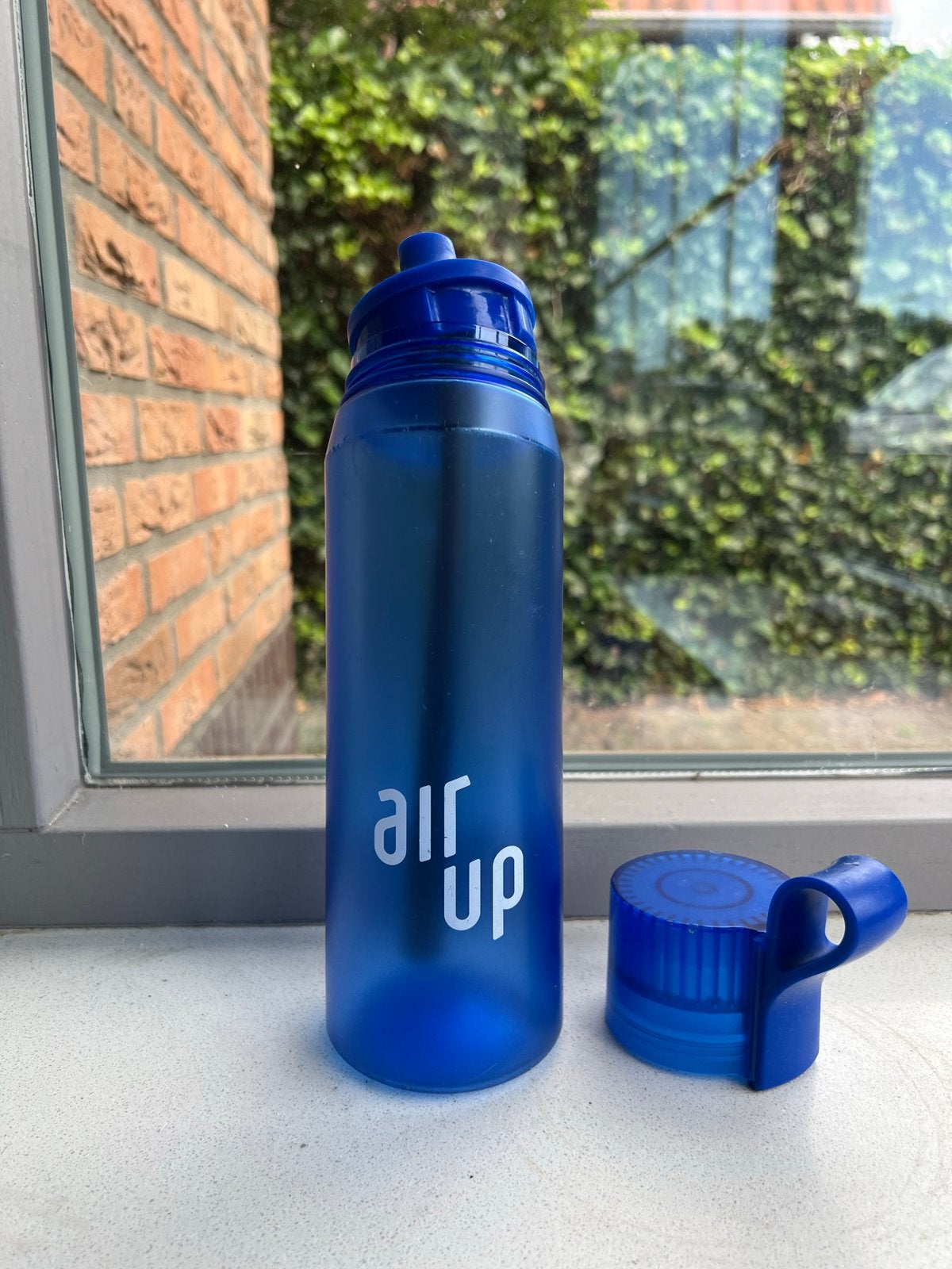Airup drinkfles blauw - Gebruikt met lichte slijtage, Sport en Fitness, Bidons, Ophalen of Verzenden, Gebruikt