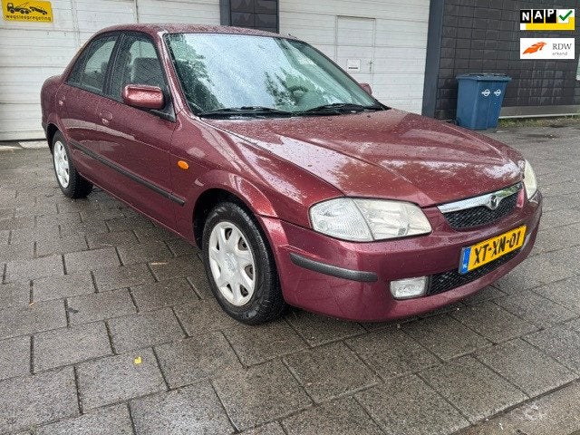 Mazda 323 1.5i GLX NAP AIRCO AUTOMAAT LAGE KM, Auto's, Mazda, 4 cilinders, 400 kg, 49 €/maand, Sedan