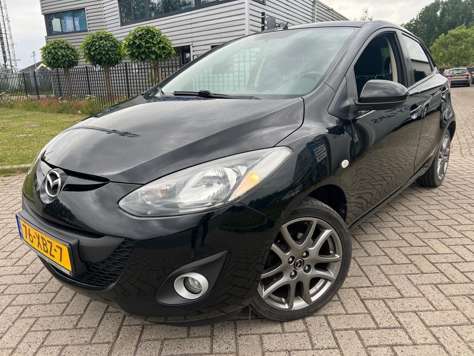Mazda 2 1.3 BIFUEL Navigator GT 2012 LPG G3 Cruise Navi 5DRS, Voorwielaandrijving, Stof, Zwart, 4 cilinders
