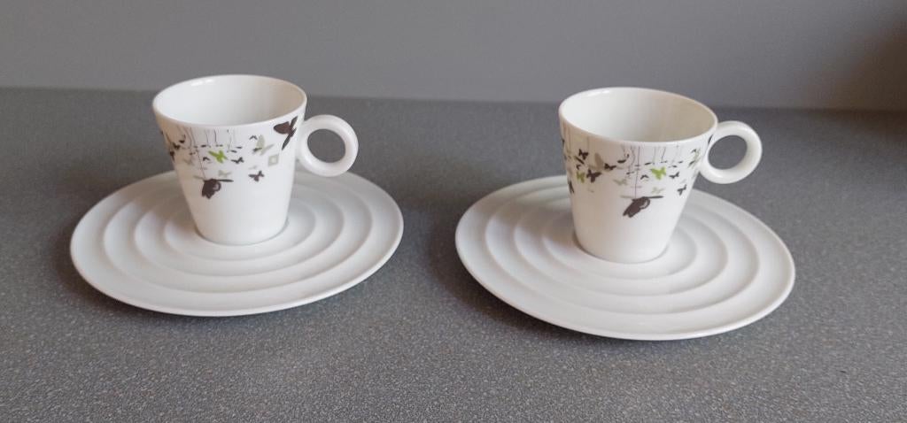Twee leuke Christian Ghion Nespresso kopjes met schoteltjes, Nieuw, Ophalen of Verzenden, Overige stijlen, Kop(pen) en/of Schotel(s)