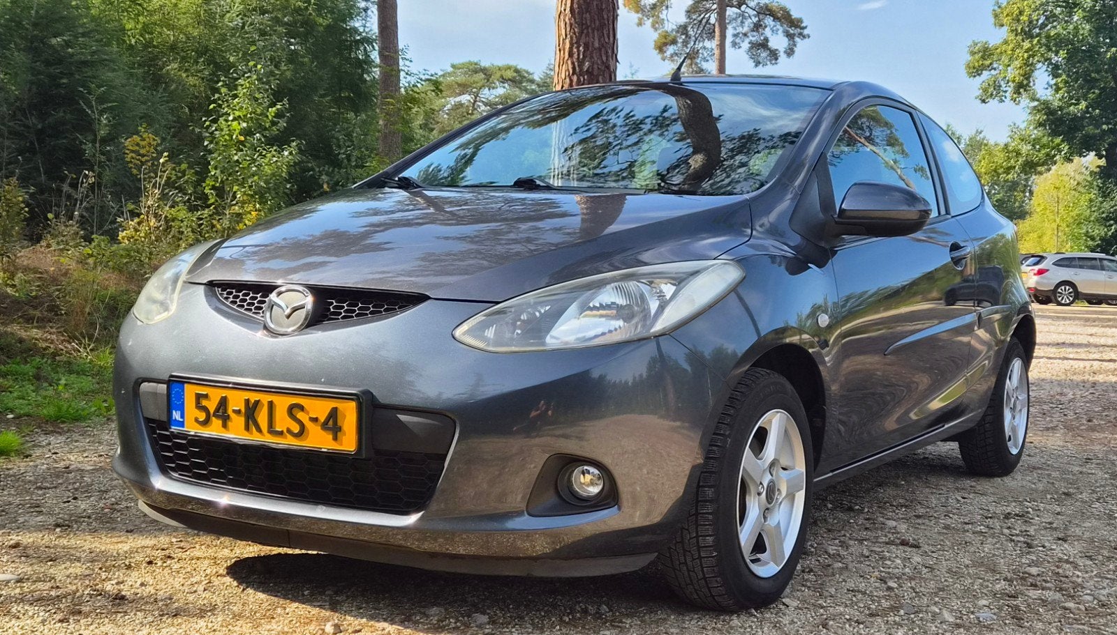 Mazda 2 1.3 55KW 3DRS 2010 Grijs, Voorwielaandrijving, Stof, 74 pk, 4 cilinders