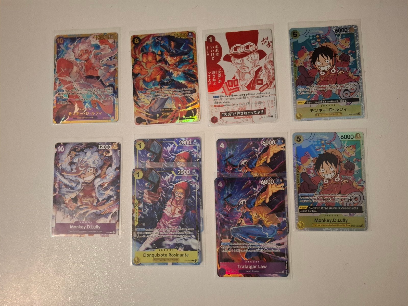 One Piece Kaarten Collectie - Verschillende SEC's, SR's, R's, Ophalen of Verzenden, Zo goed als nieuw, Meerdere kaarten, Foil