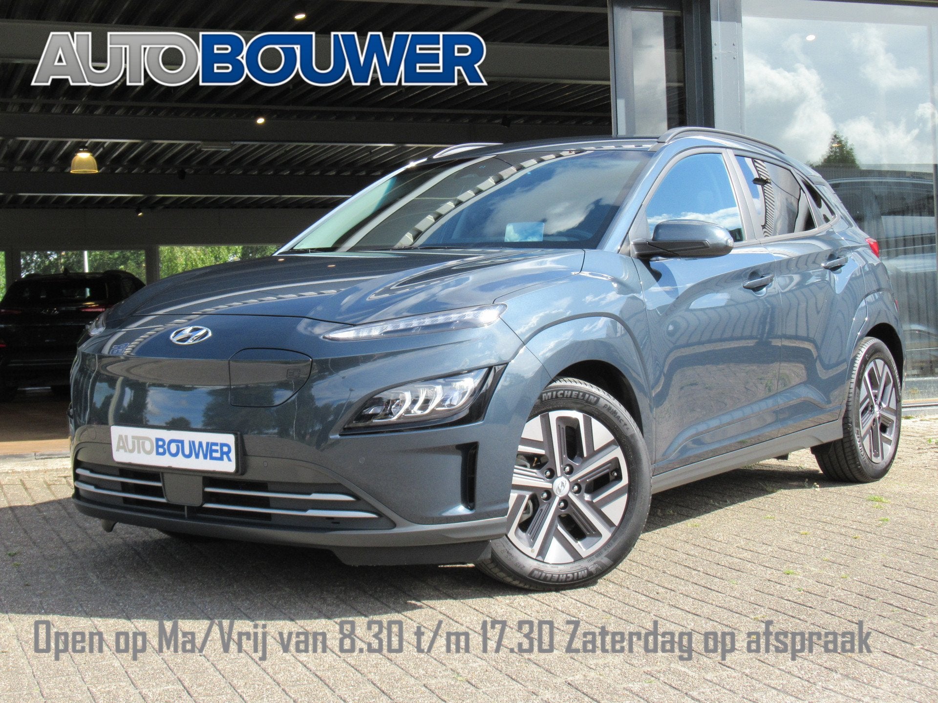 Hyundai KONA EV Premium 64 kWh | 3 fase | warmtepomp 1e eige, Auto's, Hyundai, Gebruikt, Grijs, 1660 kg, Voorwielaandrijving