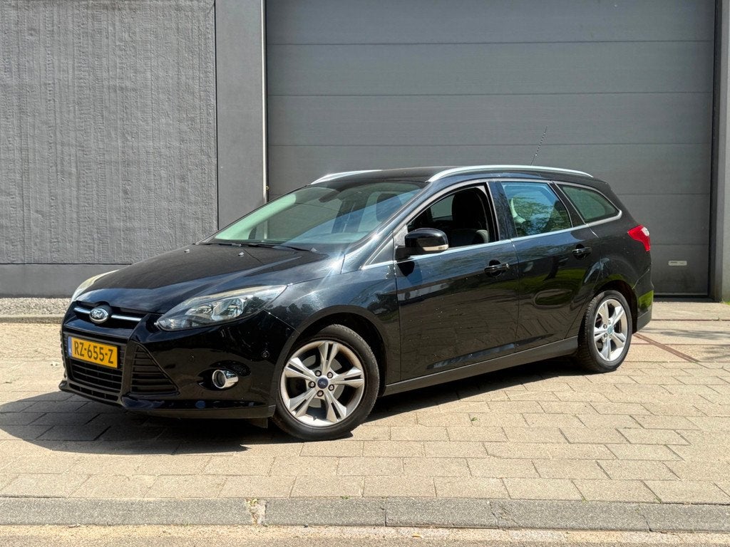 Ford Focus Wagon 1.0 EcoBoost Titanium, Auto's, Euro 5, 125 pk, Gebruikt, Zwart