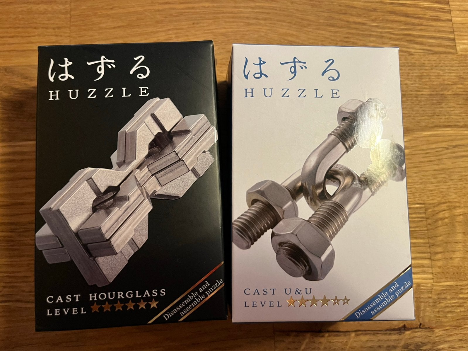 2 puzzels: Huzzle Hanayama Cast Hourglass en U&U, Hobby en Vrije tijd, Denksport en Puzzels, Zo goed als nieuw, Rubik's of 3D-puzzel