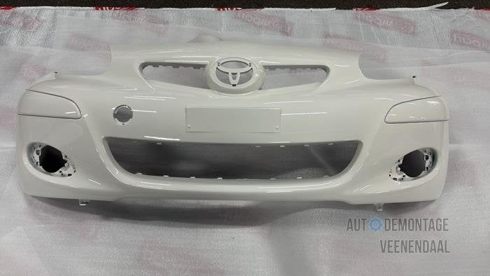 Voorbumper van een Toyota Aygo (068), Auto-onderdelen, Carrosserie en Plaatwerk, -, -, Nieuw, Ophalen of Verzenden