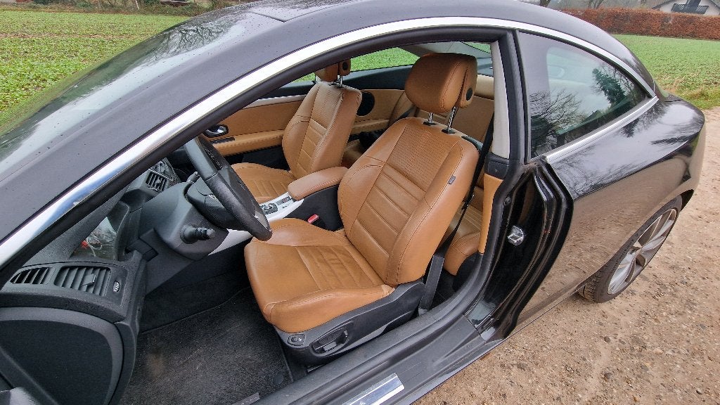 Renault Laguna 3.5 V6 175KW Coupe AUT 2009 Zwart, Auto's, 4 stoelen, Zwart, Bruin, 650 kg