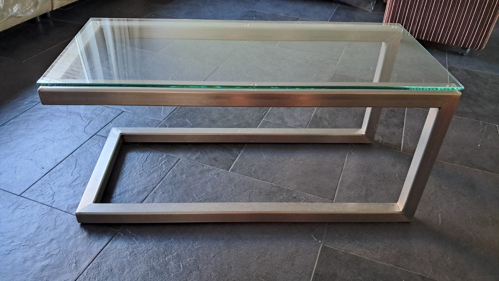 Design RVS salontafel met dik helderglazen blad., Ophalen, 50 tot 100 cm, 50 tot 100 cm, Zo goed als nieuw