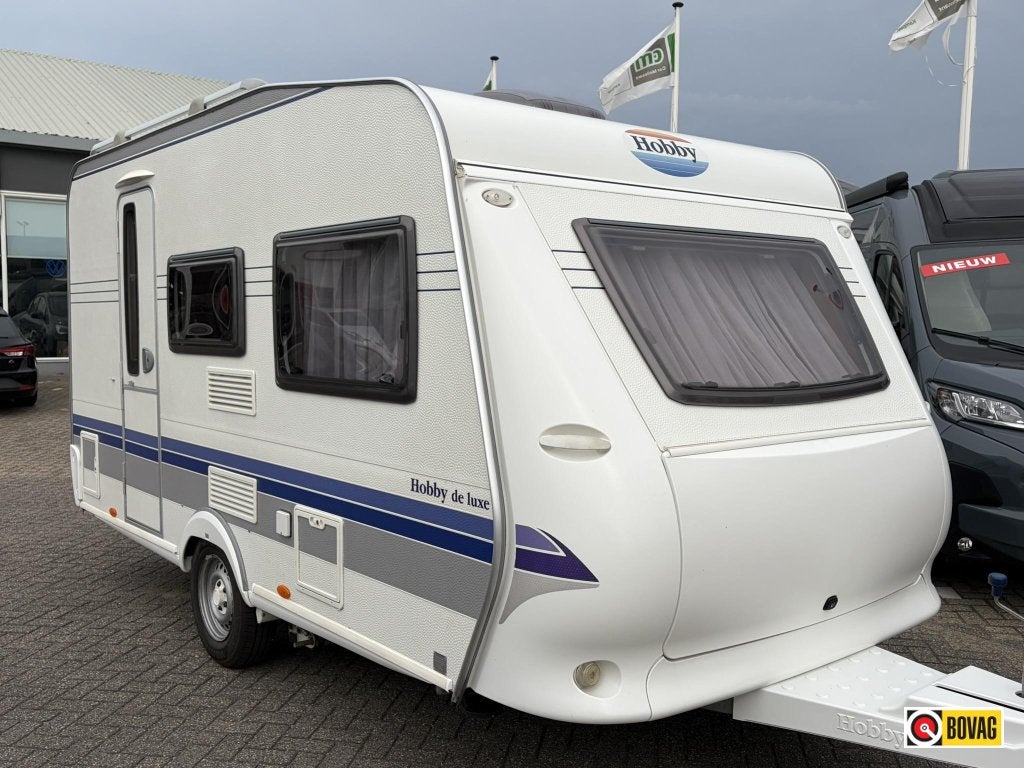 Hobby De Luxe 400 SF AIRCO/LUIFEL/MOVER/FIETSENDRAGER, Hobby, Bedrijf, Treinzit, 4 tot 5 meter