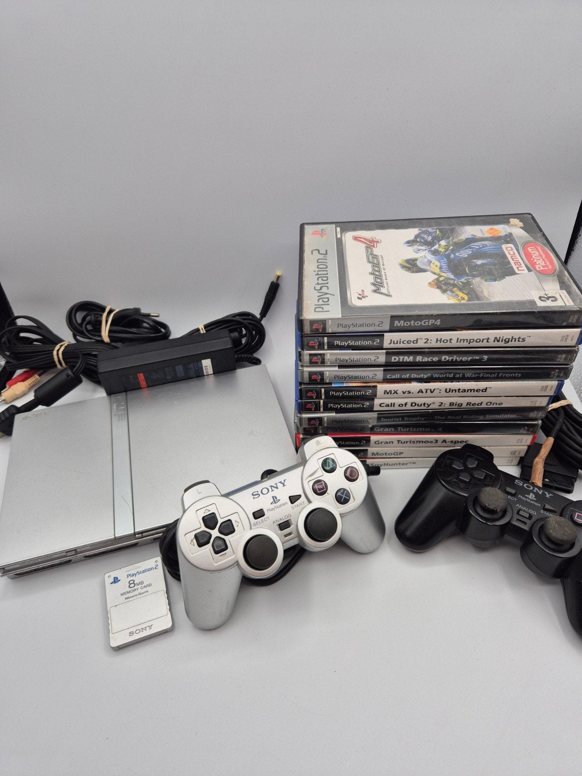 Sony PlayStation 2 Slim met 2 controllers en 10 games, Gebruikt, Met games, Ophalen of Verzenden, Sony Interactive Entertainment