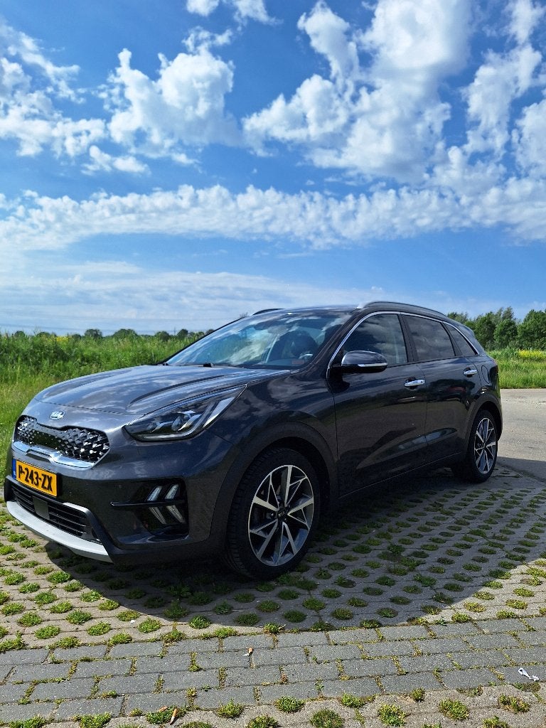 Kia Niro 1.6 GDi Hybrid ExecutiveLine, JBL, Met Kia Garantie, Auto's, Kia, Zwart, 1580 cc, Leder, Lichtsensor