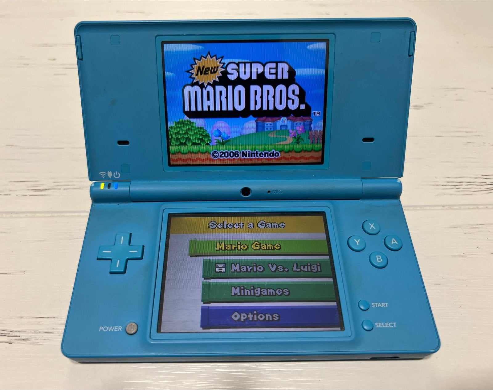 Turquoise Nintendo DSi met games - Zeer goede staat!, Met games, Blauw, Dsi, Ophalen of Verzenden