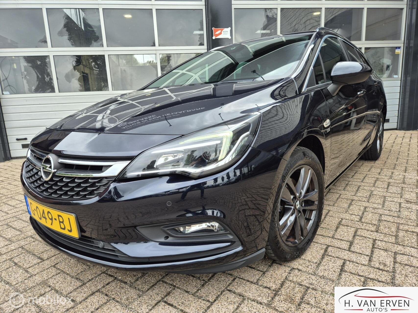 Opel Astra Sports Tourer 1.4 Turbo 120 Jaar Edition, Auto's, Voorwielaandrijving, 4 cilinders, 150 pk, Blauw