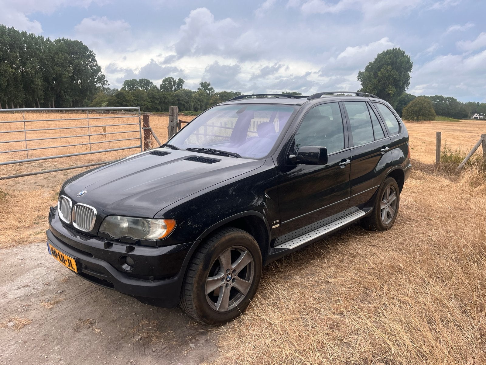 BMW X5 4.4 I AUT 2003 Zwart, Auto's, BMW, Automaat, 138 €/maand, 2080 kg, Zwart