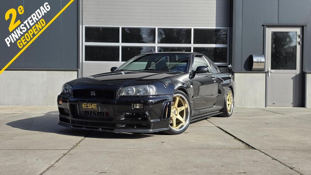 Nissan Skyline R34 GTR V-spec LHD (UK-Spec) 1 of 80, Auto's, Stof, Zwart, 2568 cc, Zwart