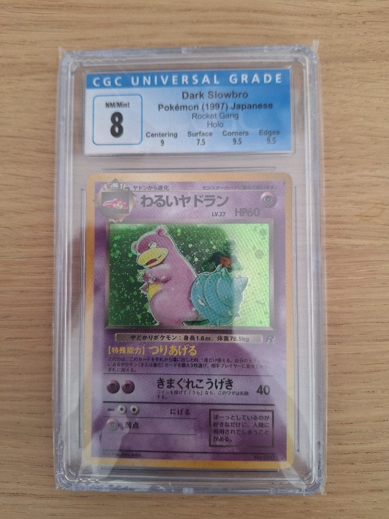 Dark Slowbro Pokémon 80 (1997) Rocket Gang Holo CGC 8, Hobby en Vrije tijd, Ophalen of Verzenden, Zo goed als nieuw, Losse kaart