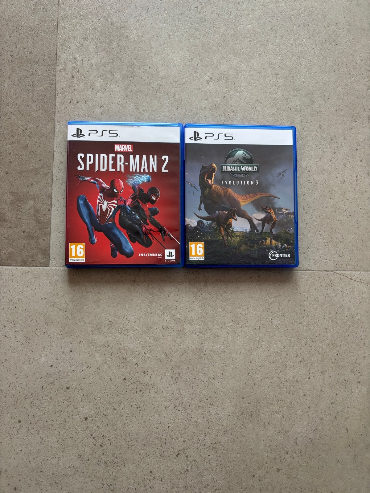 2 PS5 Games: Spider-Man 2 & Jurassic World Evolution 3, Spelcomputers en Games, Games | Sony PlayStation 5, 1 speler, Zo goed als nieuw