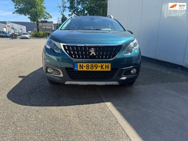 Peugeot 2008 1.2 nieuwe distributie nieuwe APK, Auto's, Voorwielaandrijving, Euro 6, 1199 cc, Leder en Stof