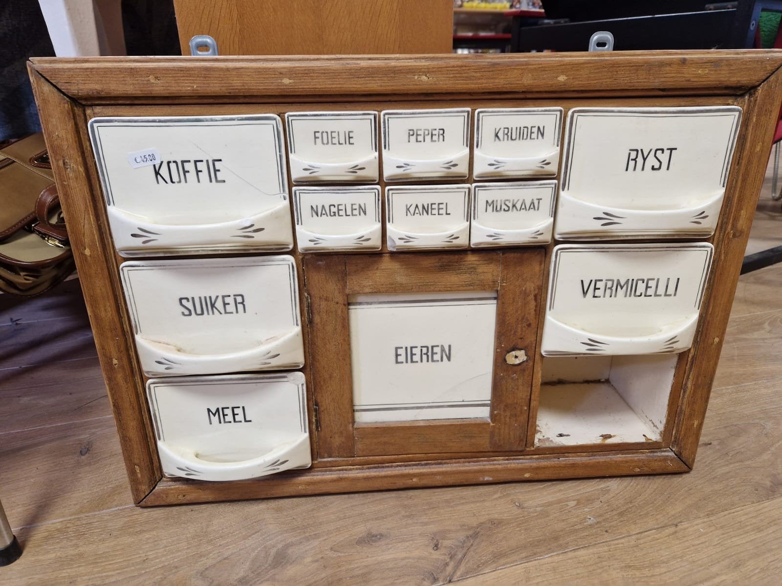 Antiek kruidenrek met porseleinen lades, Ophalen
