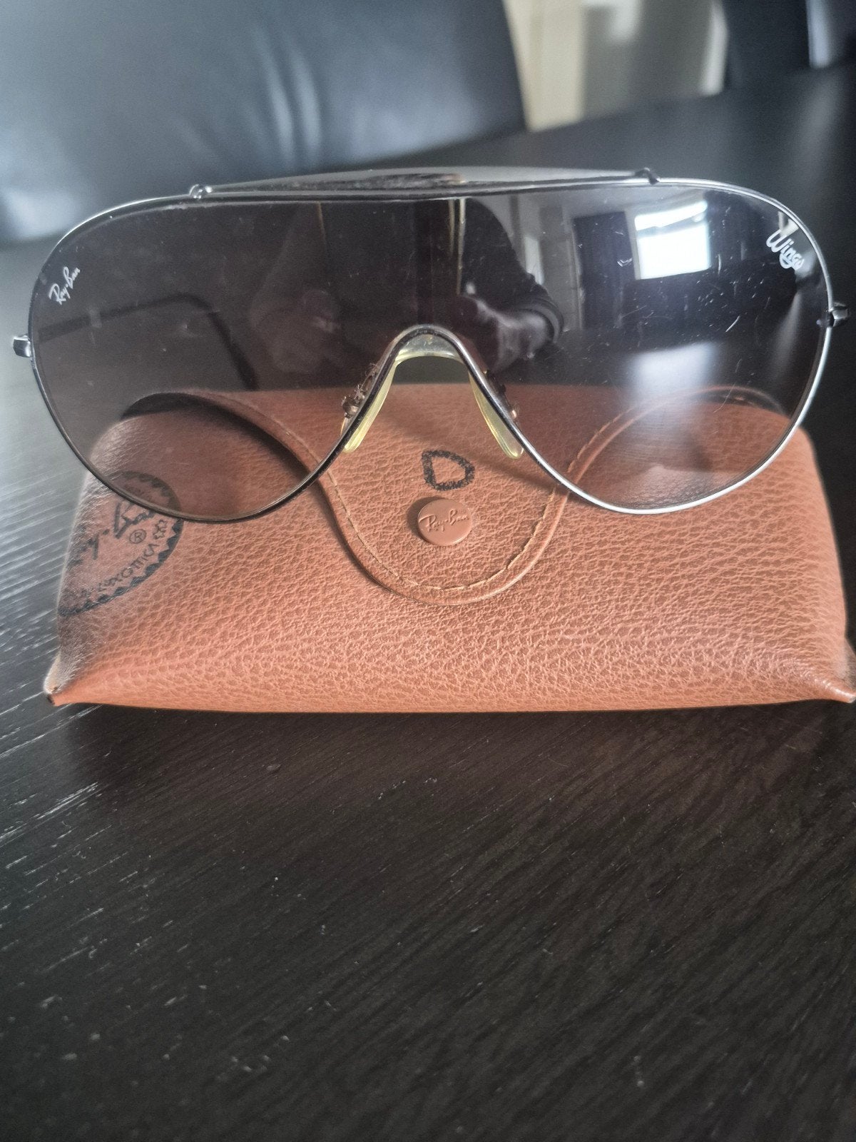 Ray-Ban Wings zonnebril met etui, Gebruikt, Zonnebril, Zwart, Ophalen of Verzenden