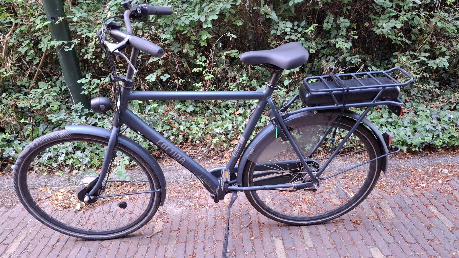 Te koop een Cortina elektrische herenfiets, Gebruikt, 59 cm of meer, 30 tot 50 km per accu, Ophalen