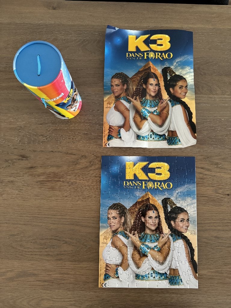 K3 Dans van de Farao puzzel in koker, Ophalen of Verzenden, Meer dan 50 stukjes, Zo goed als nieuw, 6 jaar of ouder