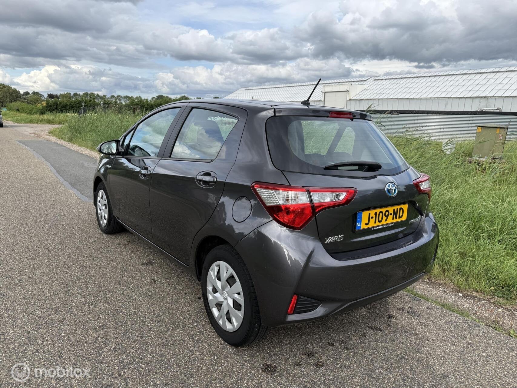 Toyota Yaris 1.5 Hybrid Dynamic / Invalide Auto / Cam / Navi, Auto's, 4 cilinders, Origineel Nederlands, Bedrijf, Hybride Elektrisch/Benzine