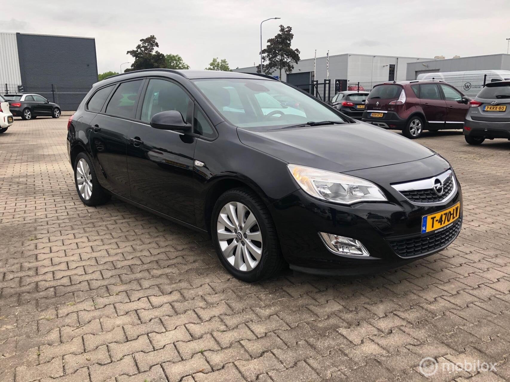 Opel Astra Sports Tourer 1.4 Turbo Cosmo Navi Cruise Airco, Auto's, Voorwielaandrijving, Euro 5, Stof, Gebruikt