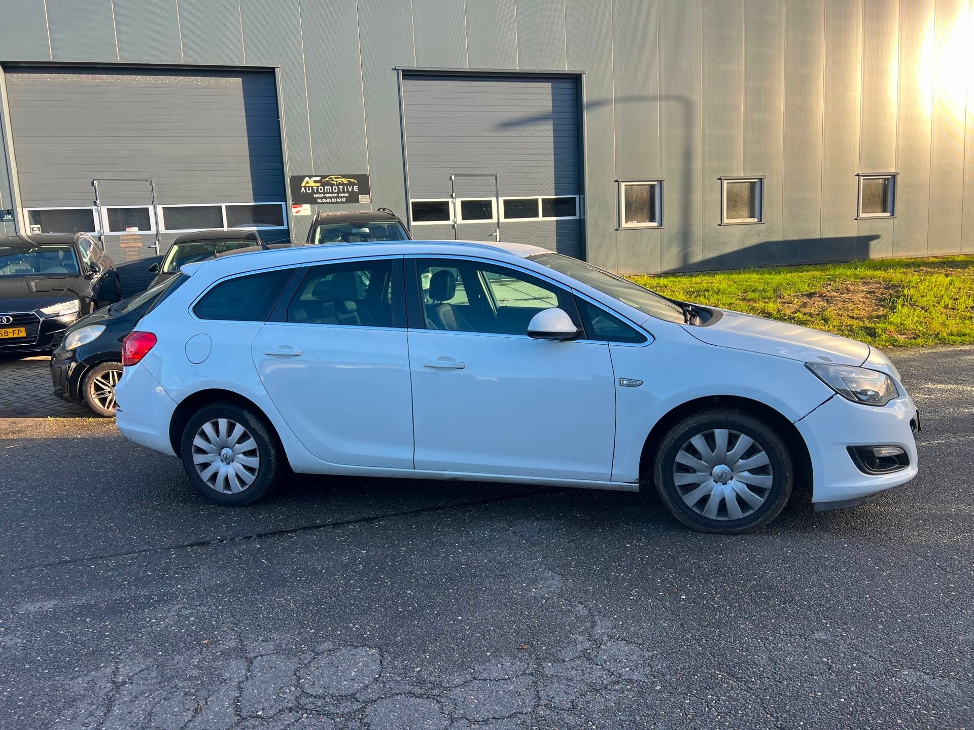 Opel Astra Sports Tourer 2.0 CDTi Cosmo automaat., Auto's, Euro 5, 4 cilinders, Wit, Verwarmde buitenspiegels