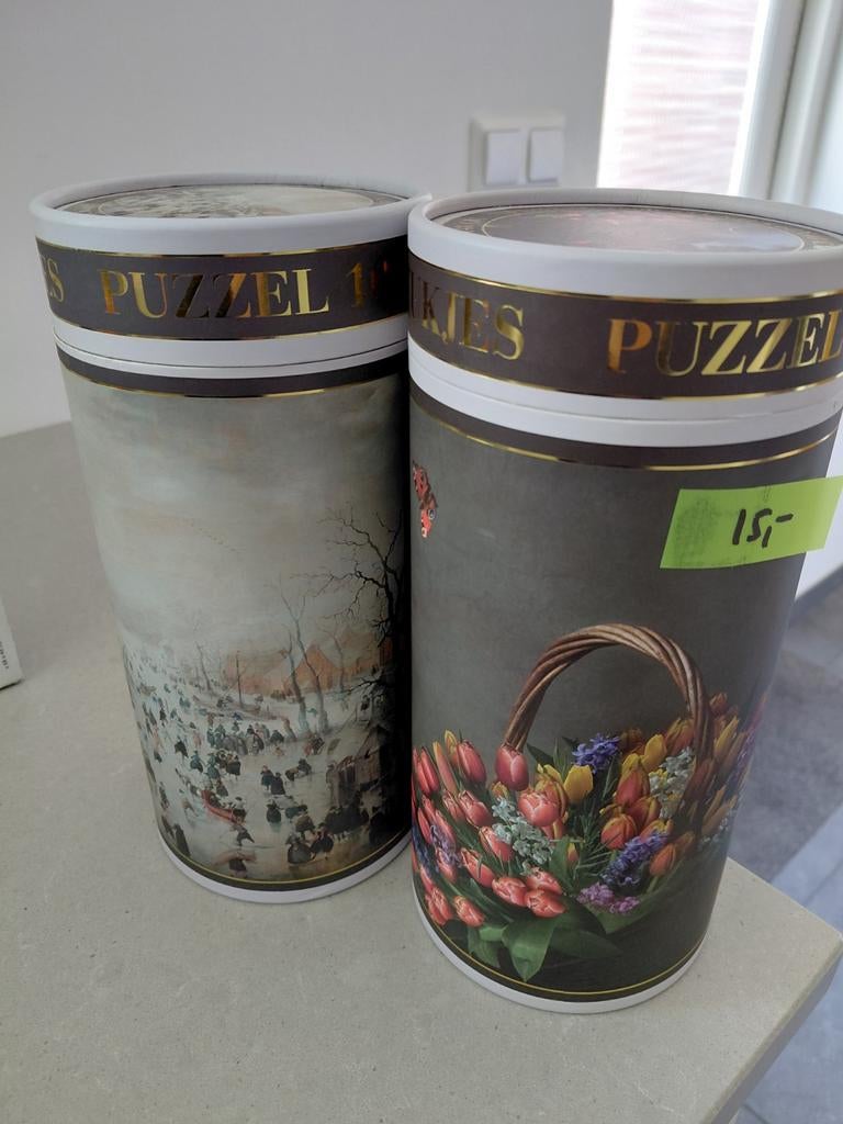 2  puzzels in koker 1000 stukjes, Ophalen of Verzenden, 500 t/m 1500 stukjes, Gebruikt, Legpuzzel