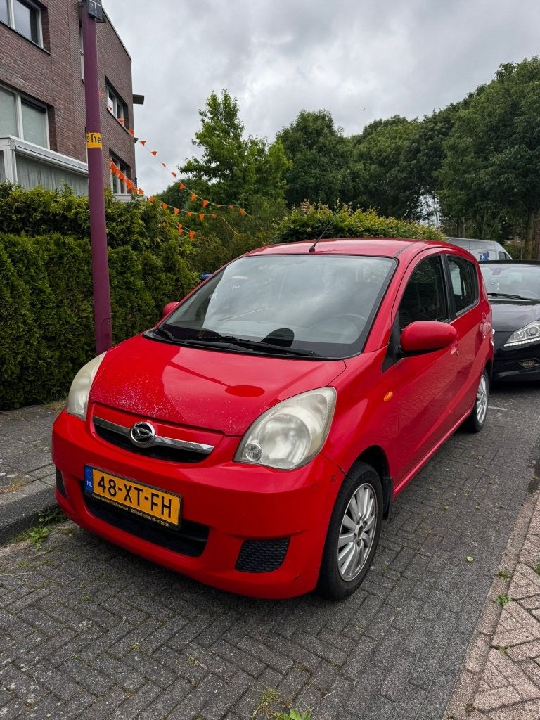 Daihatsu Cuore 1.0 5D 2007 Rood, Auto's, Daihatsu, Voorwielaandrijving, Stof, 600 kg, Zwart