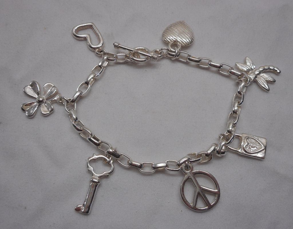 Zilveren bedel armband met 7 mooie bedels nr.114