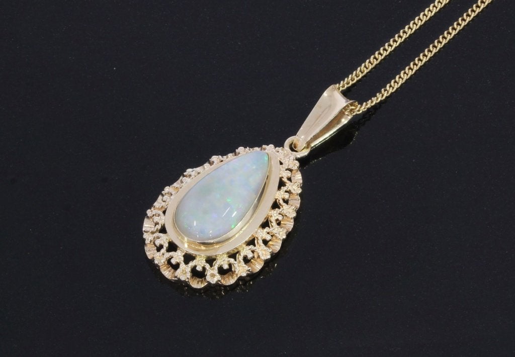 Opaal edelsteen fraaie 14k gouden ketting hanger dames, Voordeelsieraden, Ophalen of Verzenden, Zo goed als nieuw, Met edelsteen