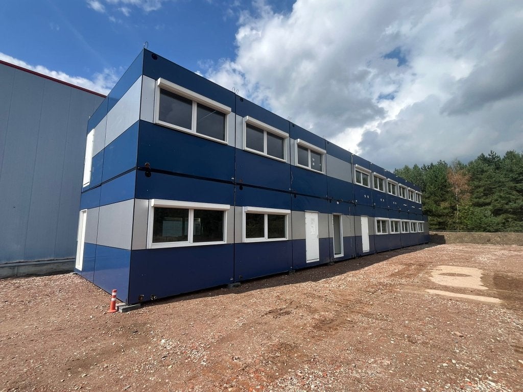 Multifunctioneel unitgebouw met 21 units, Ophalen