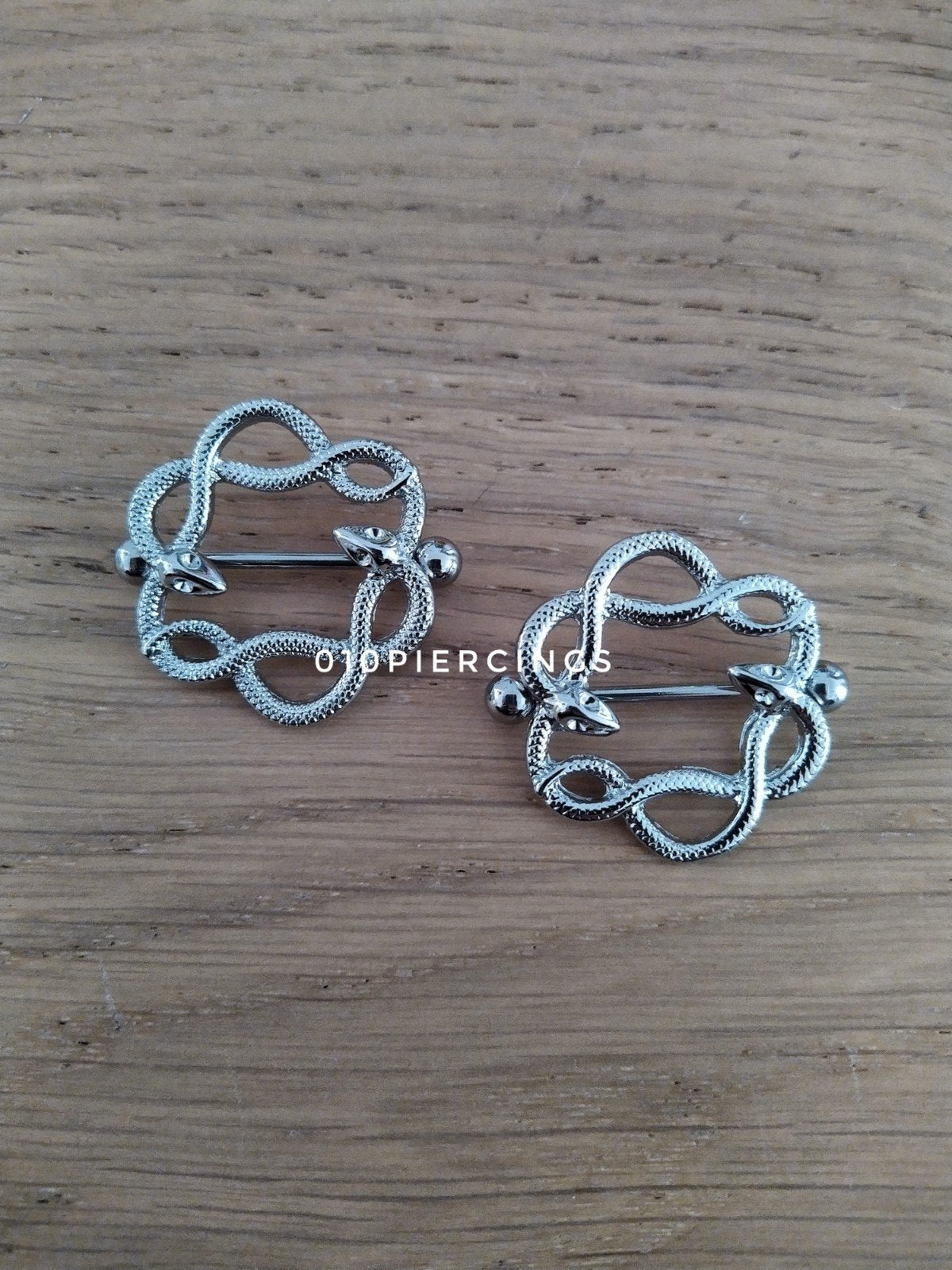 Nieuwe tepelpiercing. Slangen. Zilver kleur., Ophalen of Verzenden, Zo goed als nieuw, Staal, Oor- of Traguspiercing