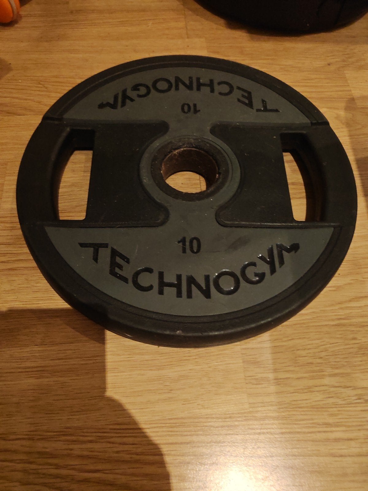 Technogym Halterschijf 10 kg, Sport en Fitness, Ophalen of Verzenden, Gebruikt, Armen, Halterschijven