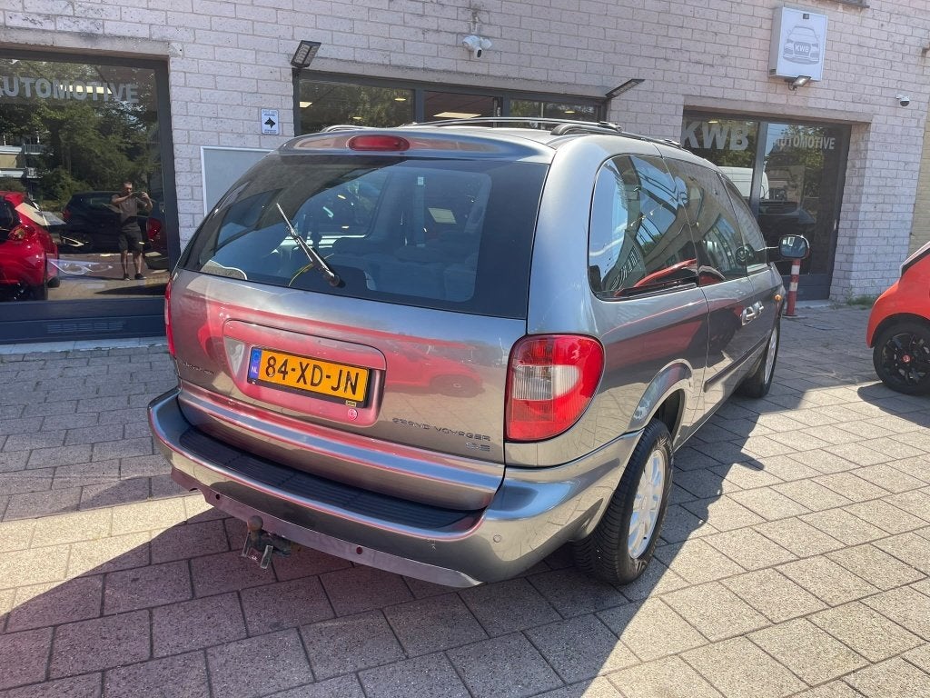 Chrysler Grand Voyager 3.3i V6 SE Luxe Trekhaak DVD 7Pers, Auto's, Automaat, 3301 cc, 450 kg, Gebruikt