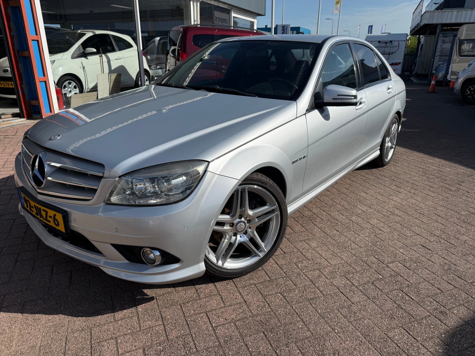 Mercedes-Benz C 180 Kompressor AMG-Line APK 10-08-2027, Dealer onderhouden, Leder en Stof, Handgeschakeld, Grijs