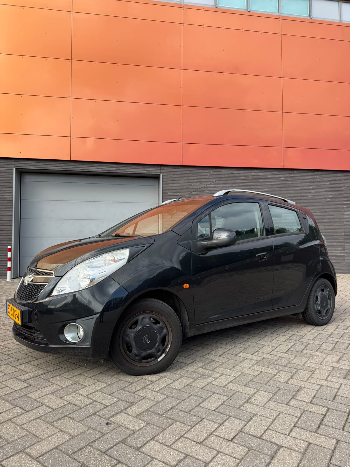 Chevrolet Spark 1.0 Bifuel 2011 Zwart, Auto's, Euro 5, 37 €/maand, 4 cilinders, Origineel Nederlands