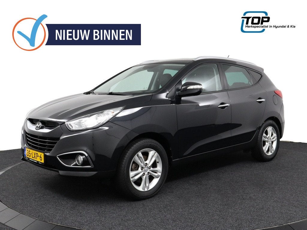 Hyundai ix35 2.0i Style (bj 2010), Auto's, Gebruikt, Zwart, 4 cilinders, Leder en Stof