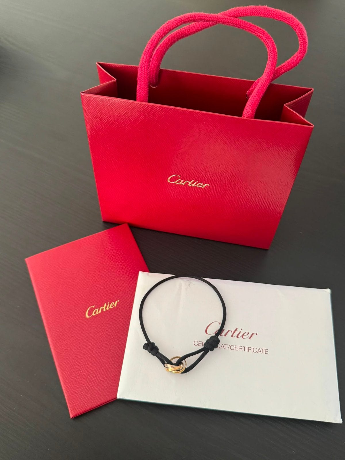 Originele Cartier Trinity armband, Sieraden, Tassen en Uiterlijk, Armbanden, Ophalen of Verzenden, Zo goed als nieuw, Zwart, Goud