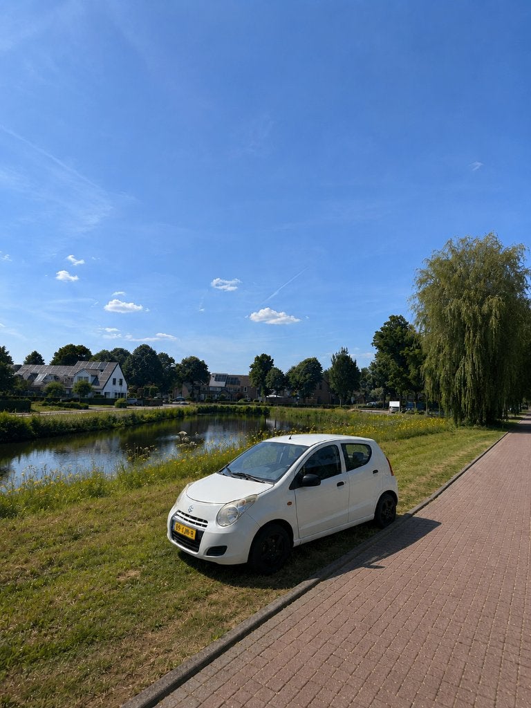 Suzuki Alto 1.0 2012 Wit, Auto's, Voorwielaandrijving, 200 kg, 4 stoelen, Origineel Nederlands