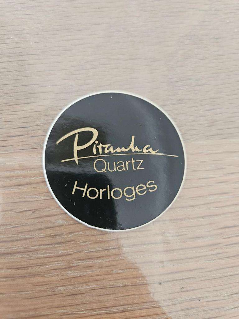 Piranha Horloge sticker, Ophalen of Verzenden, Zo goed als nieuw