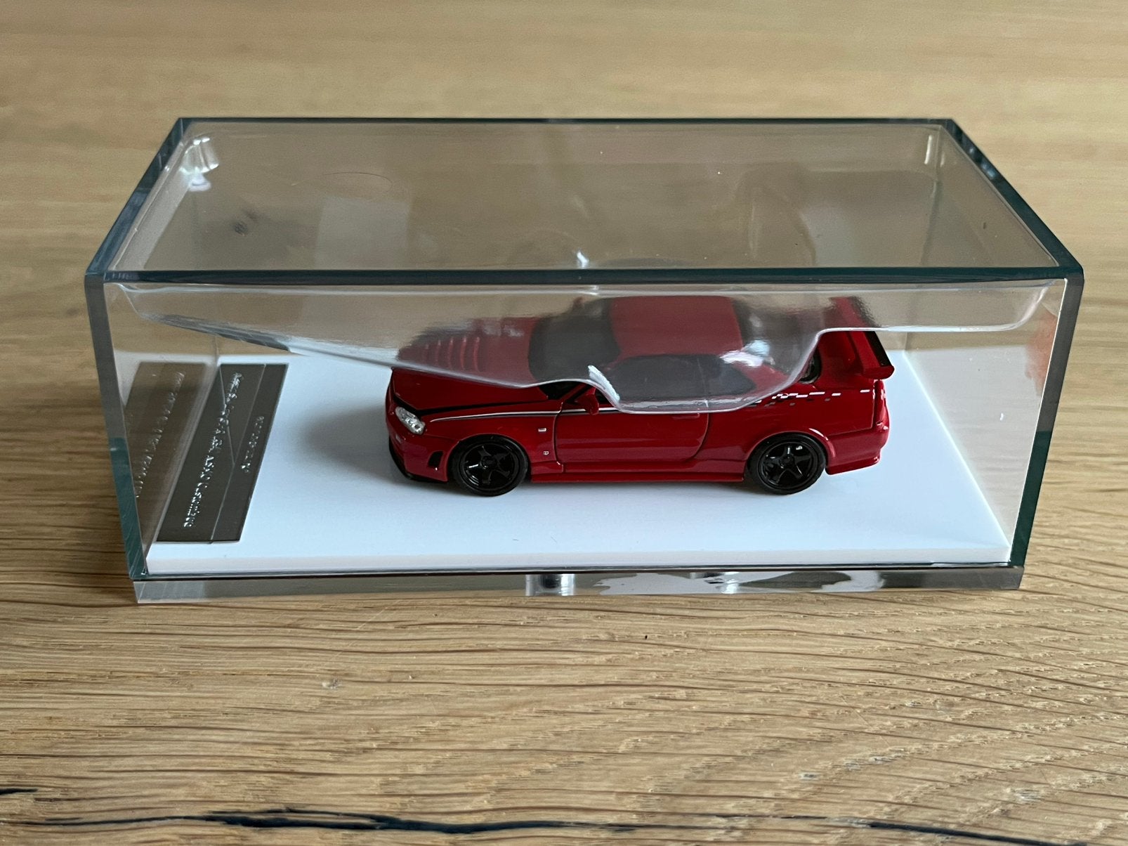 Nissan Skyline GT-R (R34) Rood 1:64 Motorhelix, Ophalen of Verzenden, Nieuw, Auto