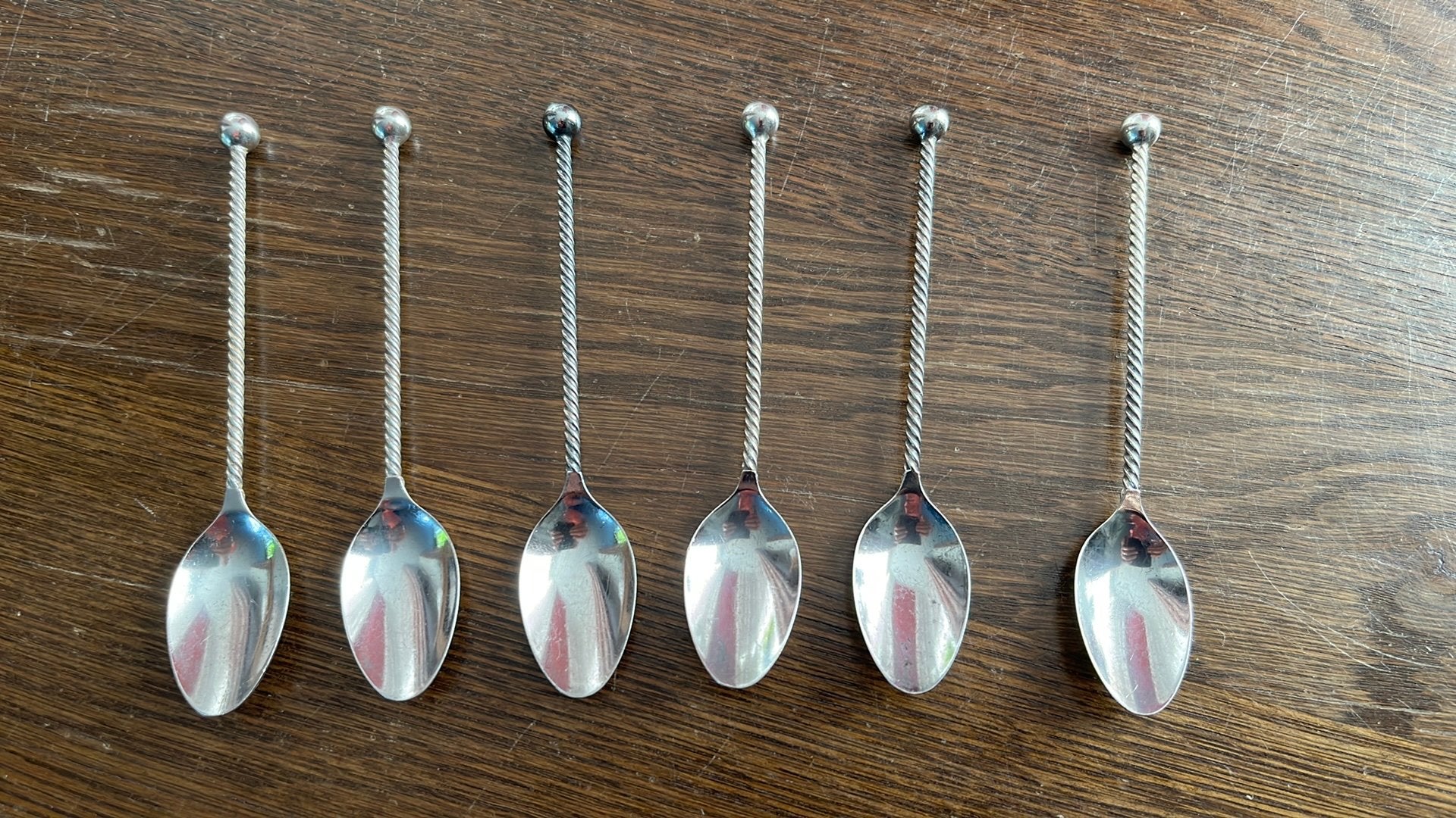 6 Verzilverde lepeltjes van DE  getorste steel, Ophalen of Verzenden