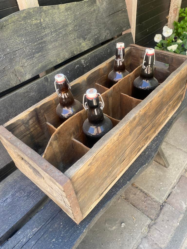 Oude flessenkist met 4 beugelflessen, Ophalen