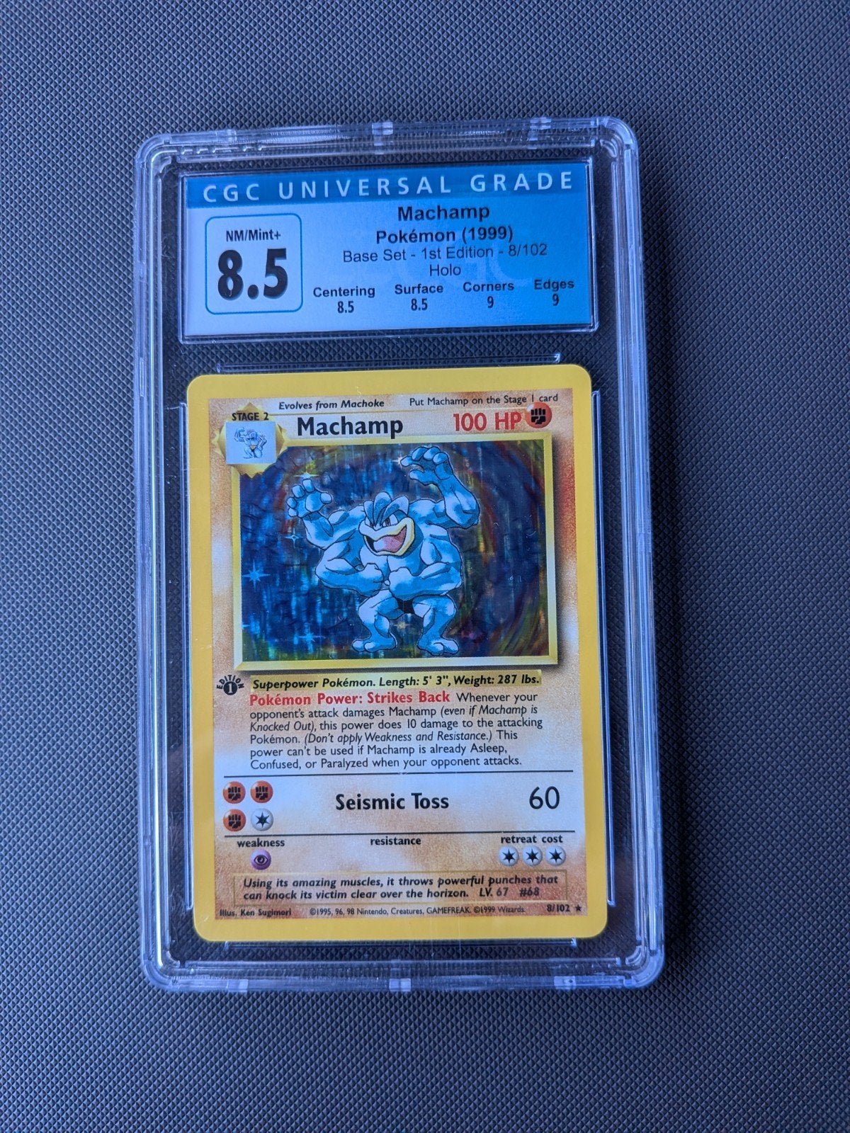 Machamp Pokémon Kaart 1st Edition Holo CGC 8.5, Hobby en Vrije tijd, Ophalen of Verzenden, Zo goed als nieuw, Losse kaart, Foil